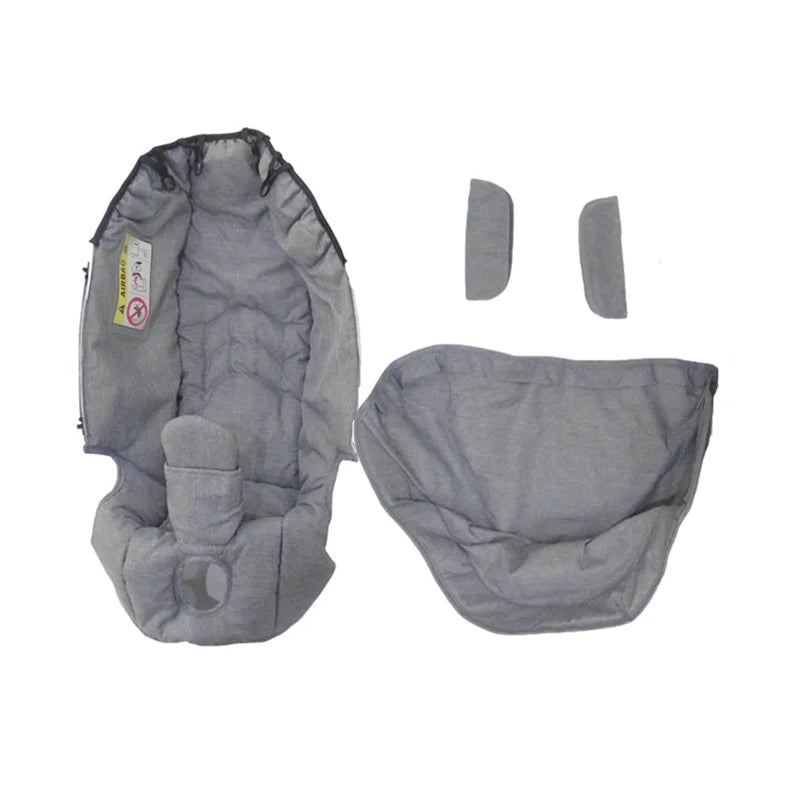 Gray stroller accessory kit including a mosquito net, rain cover, and other items.