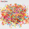 A pile of colorful soft polymer clay slices assorted for nail art and DIY crafts