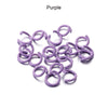 A collection of purple metal open jump rings for DIY jewelry making.