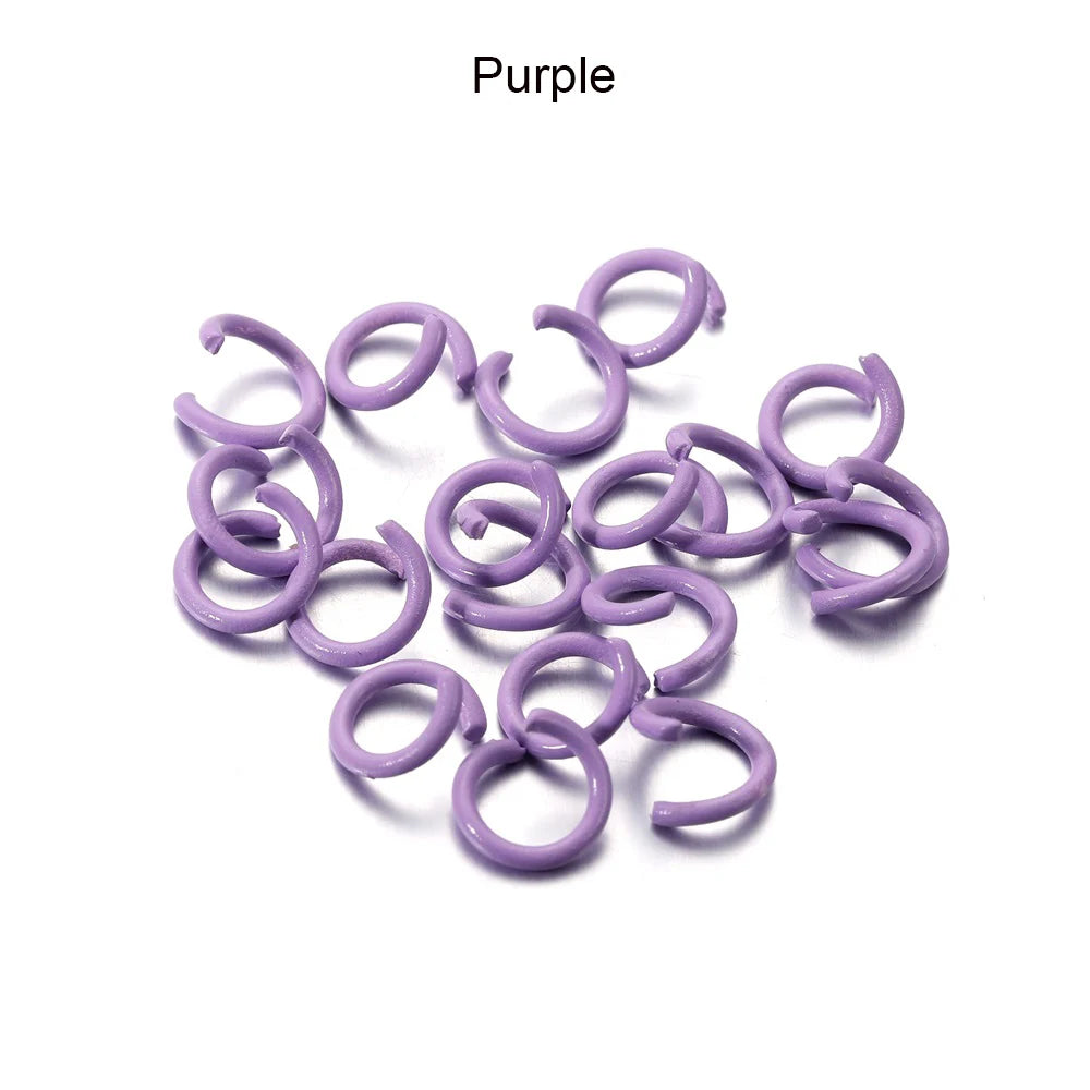 A collection of purple metal open jump rings for DIY jewelry making.