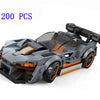 A gray and orange classic rally car building block set with 200 pieces.
