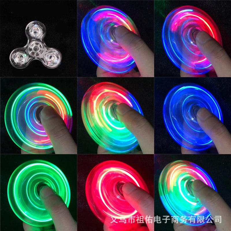 A collection of glow-in-the-dark LED fidget spinners demonstrating various colors and spinning motions.