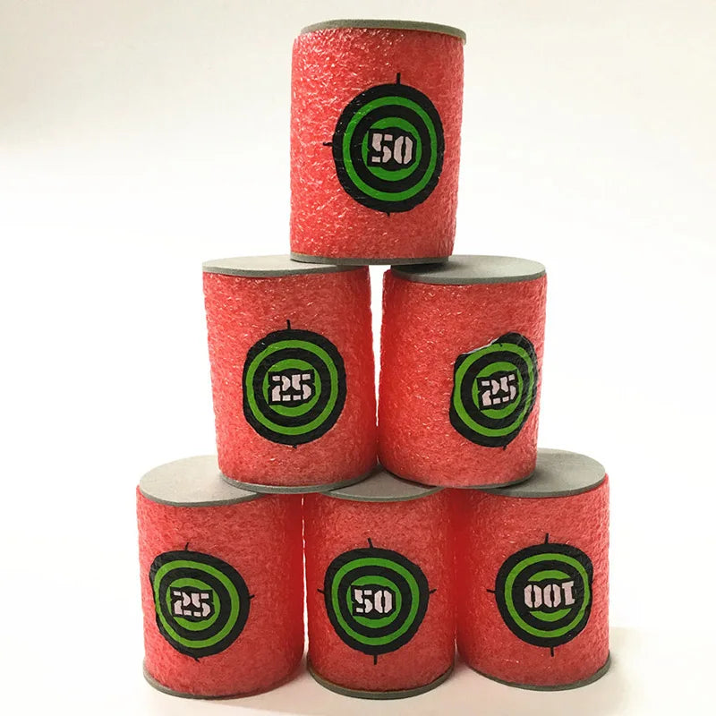 A stack of red foam dart refills with black and green target markings, showing various numbers like 25, 50, and 100.