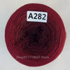 A spool of dark red yarn labeled A282, likely rainbow gradient mercerized cotton cake yarn.