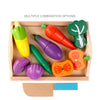A wooden magnetic fruit and vegetable cutting play set featuring various colorful fruits and vegetables.