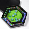 A hexagonal dice tray with a velvet green interior filled with colorful dice and a black storage box.