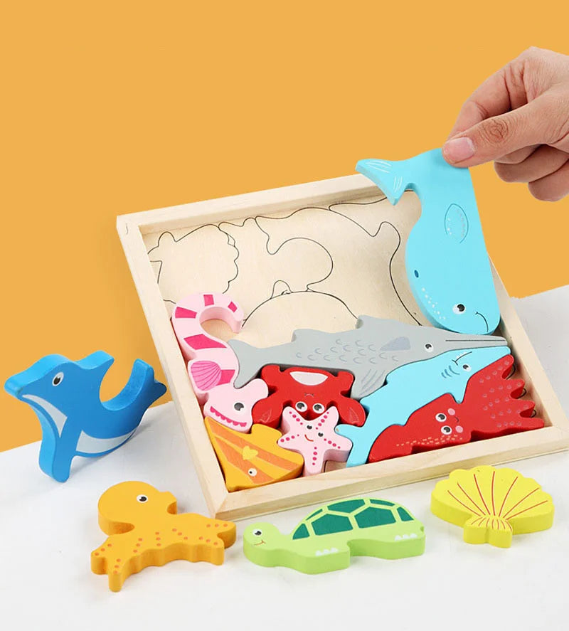 A wooden tangram puzzle board with various blue, red, and yellow shapes including fish, turtles, and starfish.
