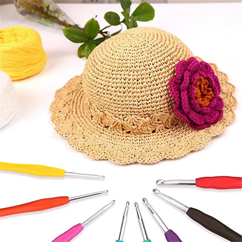 A set of various crochet hooks and a natural fiber hat are displayed on a white background.