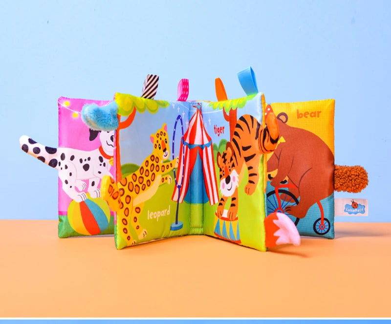 A colorful cloth book featuring various jungle animals like a tiger, leopard, and bear for baby sensory development.