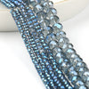 Close-up of a strand of faceted blue crystal glass beads for jewelry making