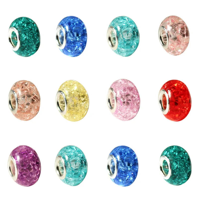 A collection of colorful resin spacer beads in various shades including green, blue, pink, yellow, and red.