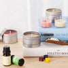 A complete candle making kit with pouring pot, wicks, and fixator displayed on a wooden surface.