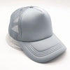 A light gray trucker hat with a mesh front and a curved brim is shown from a slight angle.