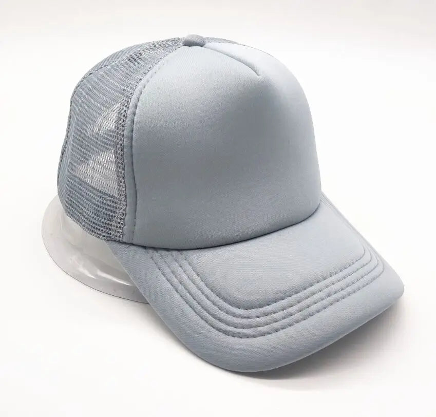 A light gray trucker hat with a mesh front and a curved brim is shown from a slight angle.