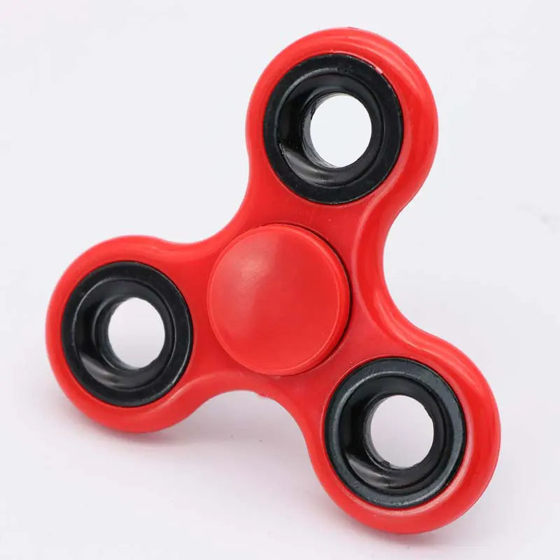 Red ABS tri-spinner fidget toy with black rings for focus and stress relief