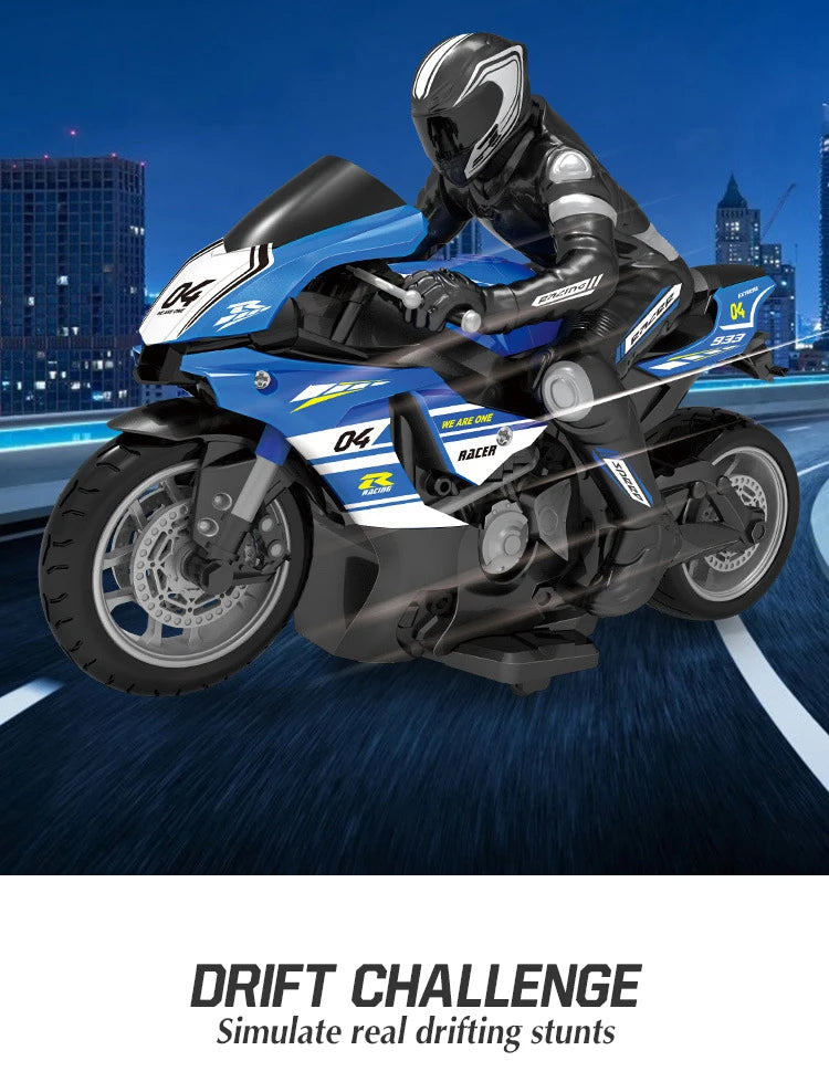 A blue and black 1:10 scale remote control stunt motorcycle is shown in a dynamic, low-angle shot against a dark background.