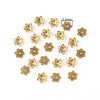 A collection of gold-colored Tibetan style hollow flower bead caps for jewelry making.