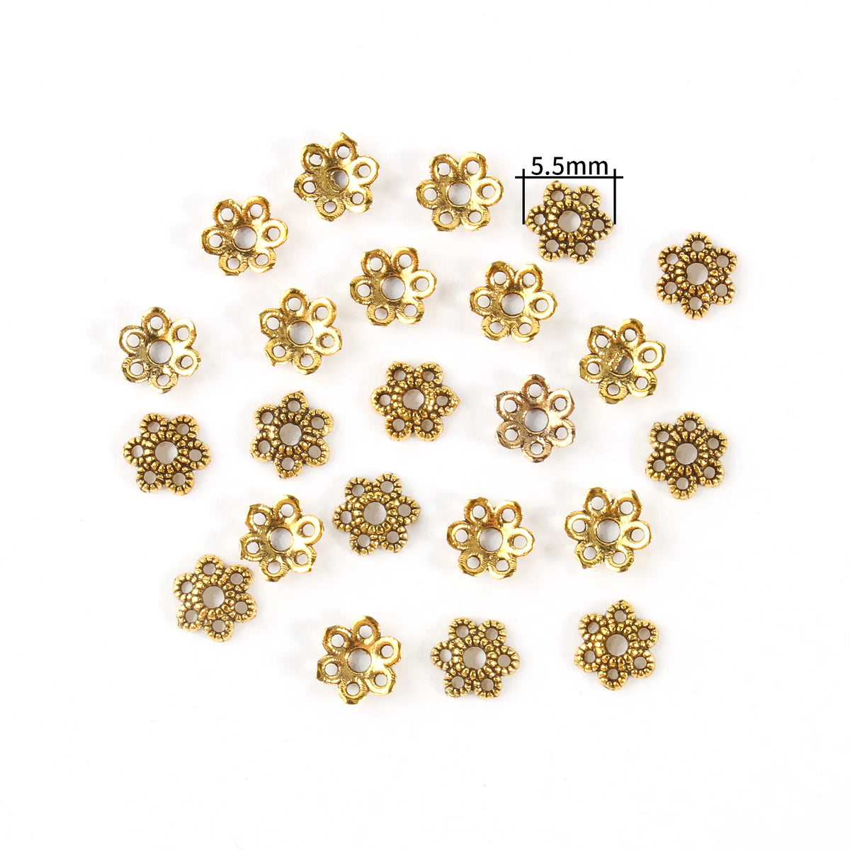 A collection of gold-colored Tibetan style hollow flower bead caps for jewelry making.