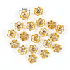 A collection of small, gold-colored Tibetan style hollow flower bead caps for jewelry making.