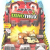 A Dinotrux dinosaur truck toy car with removable dinosaur figures displayed in its packaging.