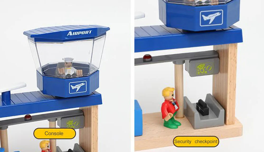 A wooden train track accessory set featuring an airport and gas station scene with blue and natural wood components.