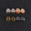 A row of eight decorative heart brass rivets for leather craft and DIY projects.