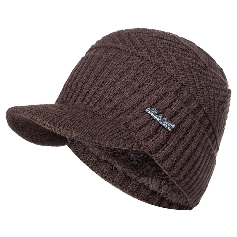 A dark brown knit beanie with a brim and a small jeans logo embroidered on the side.