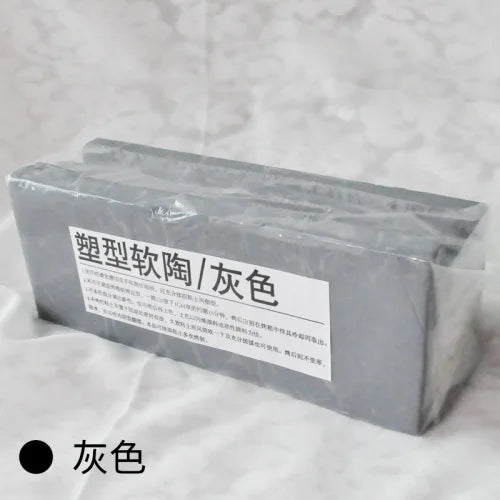 A rectangular block of gray professional soft polymer clay for sculpting and doll making