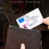 A brown leather coin purse with a zipper is shown next to a driver's license and shoes.