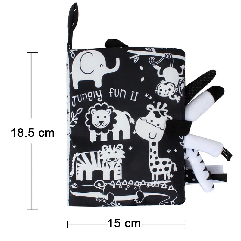 A black cloth book featuring various white animal illustrations like an elephant, lion, giraffe, and zebra, designed for baby