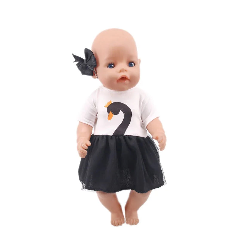 A baby doll with light skin and blonde hair wearing a white top and a black skirt.