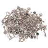 A pile of vintage metal key charms and antique keys for DIY jewelry making