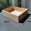 A light wooden box shaped like a rectangular block with an open top, showing its dimensions.