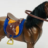 A brown horse figurine with a leather saddle and riding prop accessory.