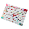 A collection of assorted acrylic stud earrings featuring hearts, stars, and moons in various colors and styles.