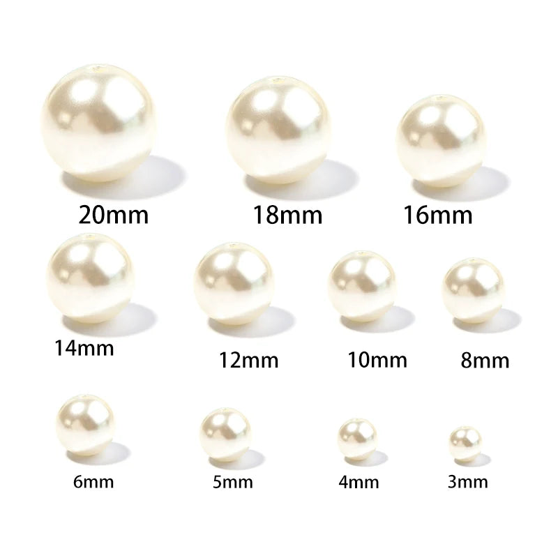A set of imitation pearl beads in various sizes ranging from 3mm to 20mm.
