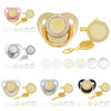 A set of baby pacifiers and clips with rhinestone accents shown in various colors and gold tones.