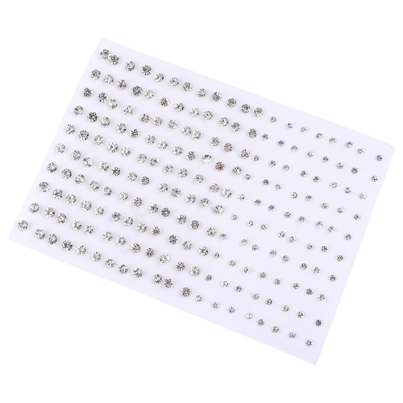 A sheet of assorted acrylic stud earrings featuring hearts, stars, and moons.