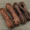 Several bundles of brown vintage faux leather cords used for DIY jewelry making