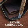 A close-up view of a brown leather storage bag with a zipper, showing the interior lining and a coin inside.
