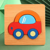 A wooden puzzle depicting a red car with blue wheels and orange body on a light wood background.
