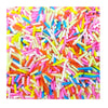 A close-up view of a pile of colorful soft polymer clay candy sprinkles for cake decorating.