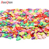 Assortment of colorful heart-shaped soft polymer clay slices for nail art and DIY crafts