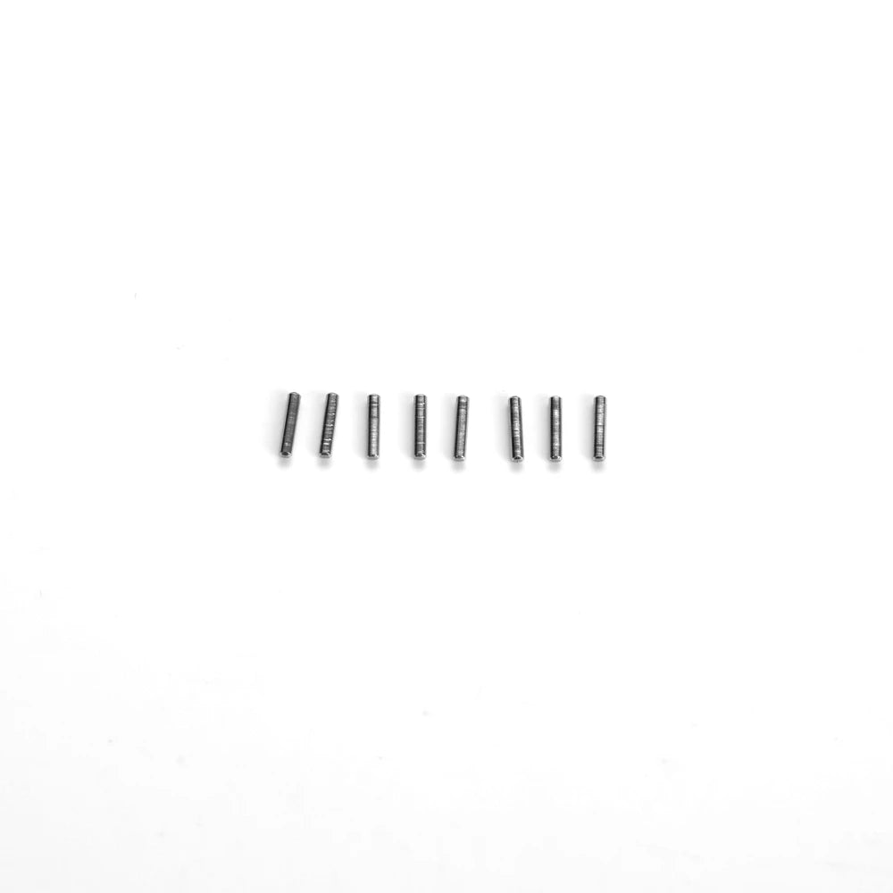 A row of small metal rods or pins used as interior upgrade parts for an RC car steering wheel.