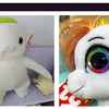 A white plush toy resembling an alien creature with green hair and large eyes.