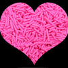 A heart shape filled with pink cylindrical polymer clay candy sprinkles for cake decorating