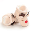 A soft, light beige plush baby first walker shoe shaped like a cute animal with closed eyes and a brown nose.