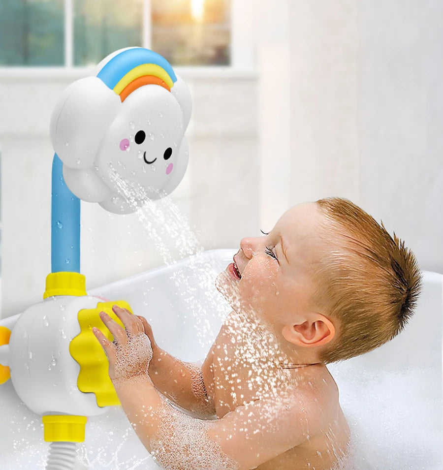 A baby is enjoying a rainbow waterfall bath toy set with sliding duck tracks in a white bathtub.