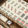 A wooden box contains a set of classic Chinese mahjong tiles with 144 tiles and a carrying case.