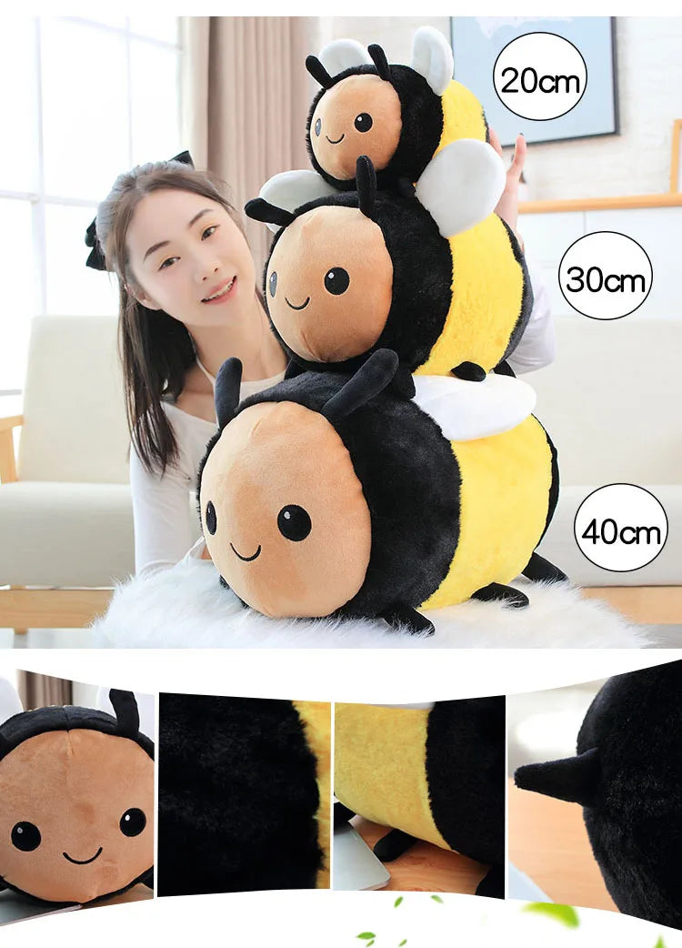 A plush toy resembling a bee and ladybug, featuring black and yellow colors, displayed with size measurements.